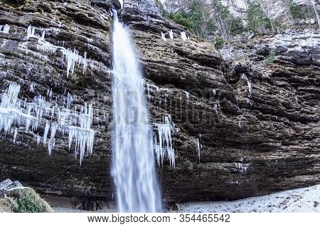 Frozen Ice Waterfall, Winter Landscape. Ephemeral, Cold And Winter Concept. Valganna Waterfall, Nort