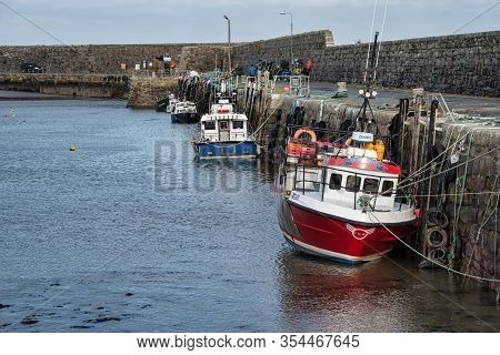 Mullaghmore, Ireland- Feb 23, 2020: Fishing Boats Moored In Mullaghmore Harbour