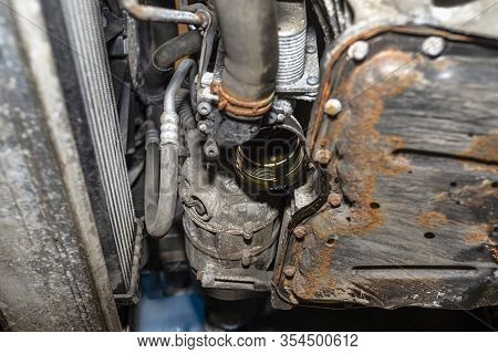 Unscrewed Oil Filter In The Diesel Engine From Its Mounting Place At The Bottom Of The Engine Next T