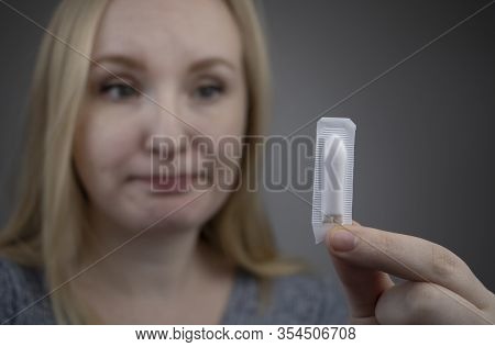 Vaginal Or Rectal Suppository In The Hands Of A Woman. The Drug Is In The Form Of Suppositories. The