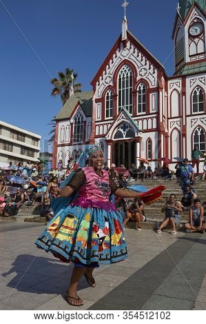 Arica, Chile - February 11, 2017: Members Of A Waca Waca Dance Group In Ornate Costume Performing At
