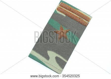 The Camouflaged Pagon Of The Russian Army's Major Located On A White Background