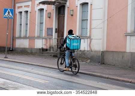 Helsinki, Finland - 3 March 2020: Wolt Partner Bike Delivery Man On Street, Illustrative Editorial