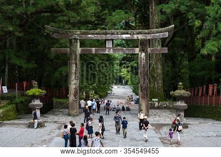 Nikko, Japan: September 9, 2016: Tourists At Nikko Temple Grounds With Ishidorii Or Nikko Outer Tori
