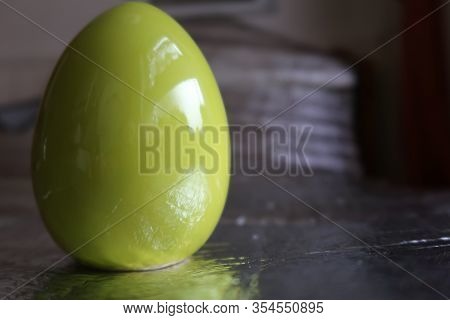 A Green Easter Egg On Silver Background