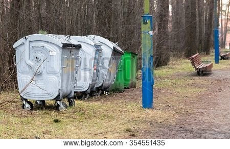 Overfilled Trash Of Large Wheelie Bins For Rubbish, Recycling And Garden Waste