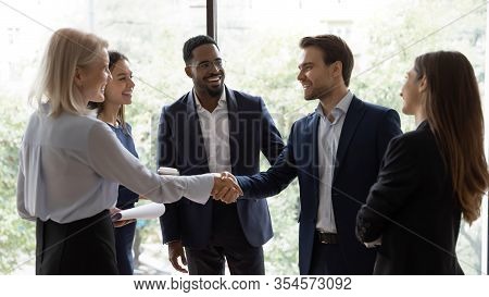 Diverse Businesspeople Handshake Getting Acquainted In Office