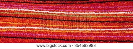 Background Of A Chenille Rug With Horizontal Stripes Colored With Bright Colors