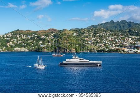 Kingstown, Saint Vincent And The Grenadines - December 19, 2018: Luxury Motor Yacht And Sailing Ship