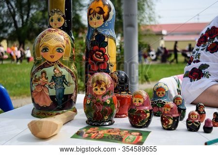 The Matryoshkas Are On The Table. National Russian Art Painted Matryoshkas.
