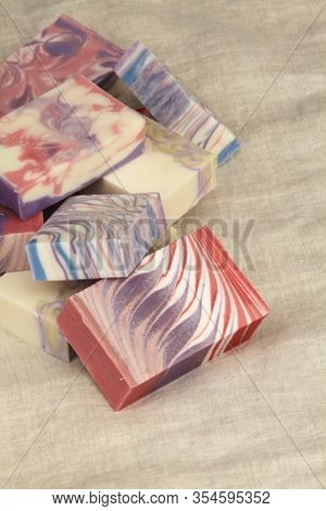 Bars Of Colourful Artisanal Handcrafted Soap On Linen Backdrop
