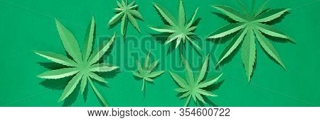 Cannabis Leaf Made Of Paper On Green Background