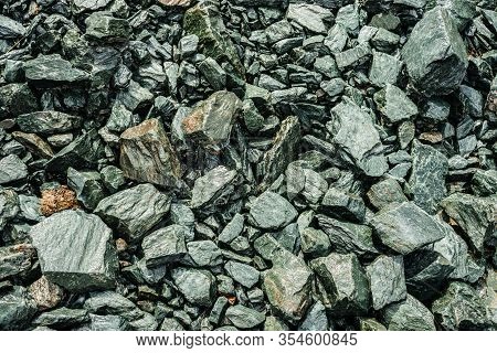 Nature Background Of Chaotic Pile Of Stones. Natural Backdrop Of Random Boulders. Combe Rock Close-u