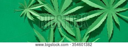 Cannabis Leaf Made Of Paper On Green Background
