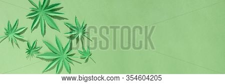 Cannabis Leaf Made Of Paper On Green Background