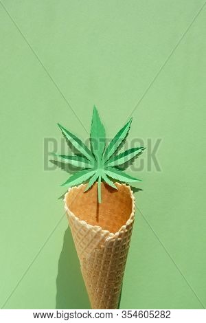 Cannabis Leaf Made Of Paper On Green Background