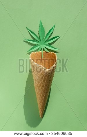 Cannabis Leaf Made Of Paper On Green Background