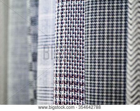 Monochrome Collection Of Fabrics In A Cage Close-up, A Fashion Trend. Samples Of Checkered Fabric In