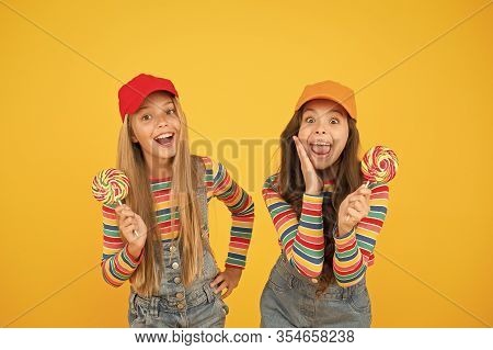 Sugar Free Treats. Happy Childrens Day. Holiday Celebration. Happy Girls Hold Lollipop Candy. Join C