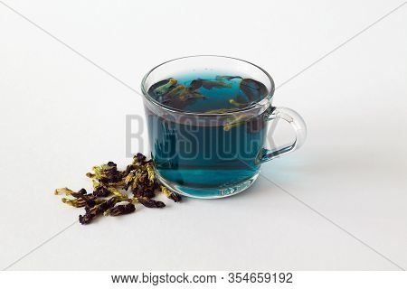 Butterflu Pea Tea. Glass Cup Of Blue Herbal Tea On A White Background. Healthy Lifestyle. Cup Of Hot