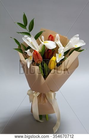 Close-up Fresh Spring Bouquet Of Tulip, Iris, Ruscus Gray Background, Selective Focus