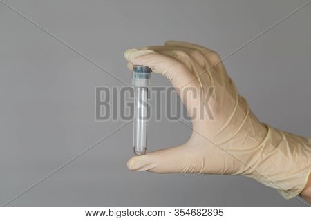 Empty Test Tube For Biomaterial Analysis In The Hands Of A Nurse. Clinical Virus Analysis With Preca