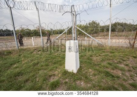 Kelebija, Serbia - October 15, 2016: Hungarian Policemen Watching The Serbian Hungarian Border Fence