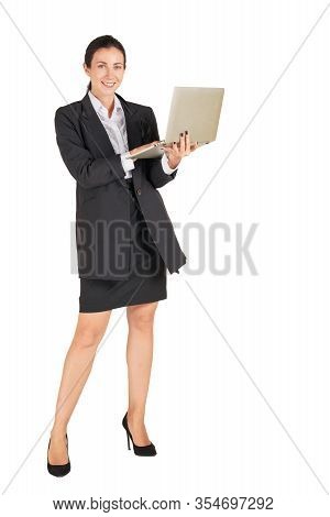 A Business Woman In A Black Suit With A Smile And Typing On A Computer Notebook. Portrait On White B