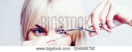 Blonde Girl Cut Forelock. Close Up Hairstyle With Bangs. Hair Care Concept