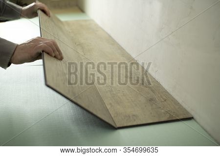 Vinyl Laminate. Laying Of The Floor Covering.