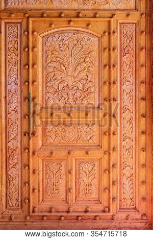 Wooden Door Of Temple In Nandgaon. India