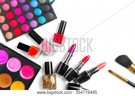 Makeup. Make-up Set Palette with colorful eyeshadows. Various cosmetics Brushes, lipgloss, lipstick, rouge, eyeshadow tints, foundation isolated on a white background. Make up artist tools 
