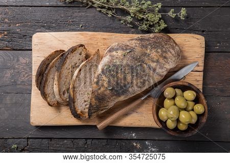 Fresh Italian Ciabatta Bread  For Leaven With Herbs, Olives On Wooden Background, Top View, Copy Spa