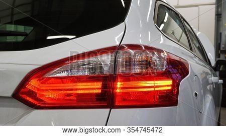 Red Rear Taillight Of A Modern Car Close-up. Service, Repair, Body Repair, Body Painting, Spare Part