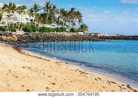 View Of Playa De Las Cucharas Beach In Costa Teguise, Lanzarote, Spain, Clear Turquoise Waters, Sele