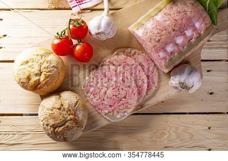 Headcheese On Wooden Cutting Board, Top View. Brawn. Pork Cold Cuts.