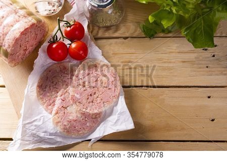 Headcheese On Wood Background, Top View. Brawn. Pork Cold Cuts.