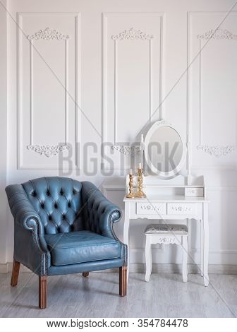 White Room With Blue Retro Chair And Mirror.