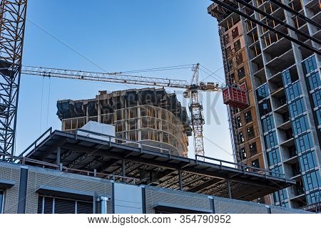High-rise Buildings Under Constraction With External Elevator On The Wall