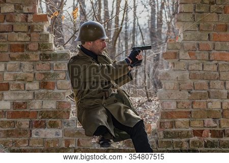 Soldier Standing A Broken Wall Defending His Position
