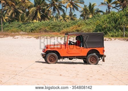 Goa, India - February 10, 2020: Lifeguard By Car On Duty At Beach.