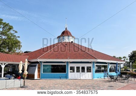 LONG BEACH, CALIFORNIA - 06 MAR 2020: Pelican Pier Pavilion, Shoreline Village at Rainbow Harbor, houses a carousel, video games, Skee-ball and Air Hockey.