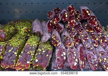 The Turkish Sweets With Nuts Close Up In The Market.