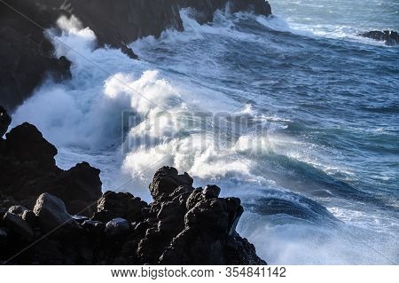 Dangerious Ocean Stormy Waves Hits Black Lava Rocks On La Palma Island, Canary, Spain