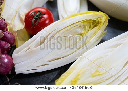 Fresh Belgian Endive Or Chicory Bitter Salad Ready To Cook Or Eat