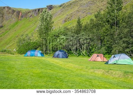 Tents At Kleifar Campsite Near Kirkjubaejarklaustur In South Iceland On A Summer Day
