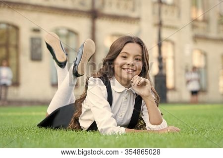 Its That Time Of Year Again. Relaxed Schoolchild. Happy Schoolchild Relax On Green Grass. Small Scho
