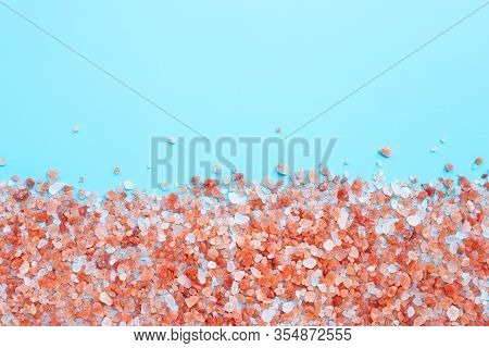 Pink Himalayan Salt On Blue Background. Copy Space