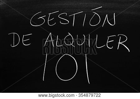 The Words Gestión De Alquiler 101 On A Blackboard In Chalk.  Translation: Rental Management 101