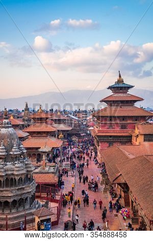 Kathmandu, Nepal - March 9 2020: Aerial View Of Patan Durbar Square. People Strolling Around The Tem
